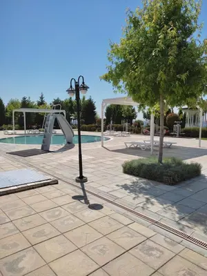 a swimming pool with a slide and a playground at Prestige Fort Beach Private Apartment-Studio 46 in Sveti Vlas