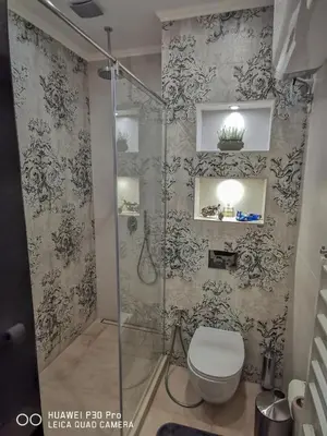 a bathroom with a shower and a toilet in it at Luxury Apartments Alix in Burgas City