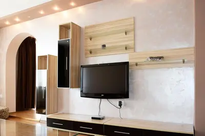 a living room with a flat screen tv on a wall at dream apartment in Obzor