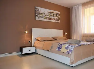 a bedroom with a large bed and a window at dream apartment in Obzor