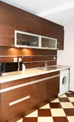 a kitchen with a sink and a microwave at dream apartment in Obzor