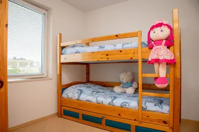 a bunk bed with a doll sitting on top of it at Villa Beni - 4 Bedroom Private House by Flаt Manаger in Lozenets