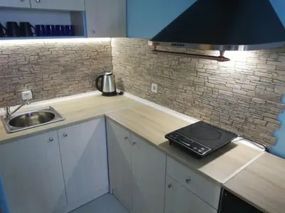 a small kitchen with a sink and a stove at The Blue Studio - In a complex next to the beach by Flаt Manаger in Pomorie