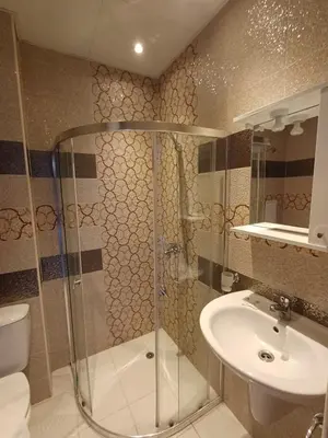 a bathroom with a shower and a sink at Admiral Plaza Premium Apartments in Sunny Beach