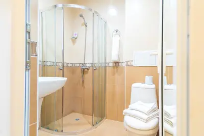 a bathroom with a shower and a toilet and a sink at Admiral Plaza Premium Apartments in Sunny Beach