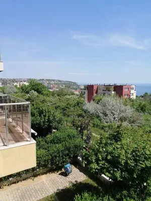 a view of a city with trees and a building at Byala-apartment-valmira in Byala