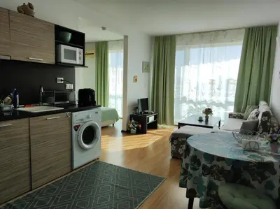 a room with a kitchen and a living room at Прекрасен апартамент с изглед към морето Сарафово 1 in Burgas City