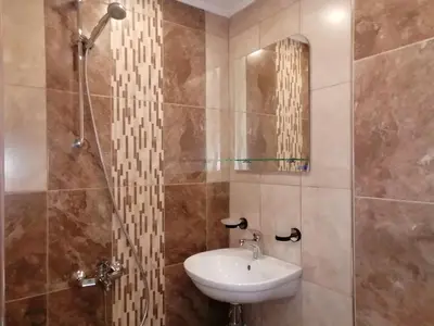 a bathroom with a sink and a mirror at Megi Apartments, Nesebar sity in Nesebar