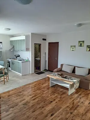 a living room with a couch and a table at Megi Apartments, Nesebar sity in Nesebar