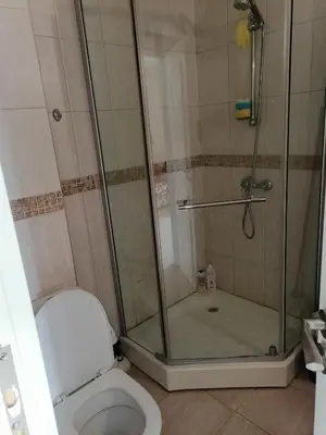 a bathroom with a shower and a toilet at Cozy studio with Pool in Sunny Beach in Sunny Beach