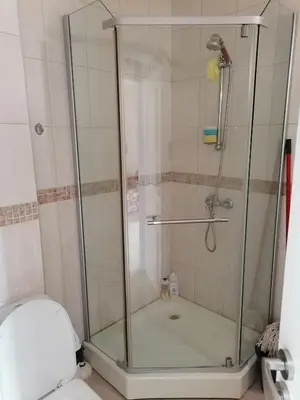 a shower with a glass door in a bathroom at Cozy studio with Pool in Sunny Beach in Sunny Beach