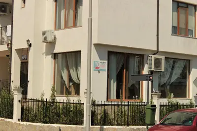 a street sign in front of a building at Villa Denta in Nesebar