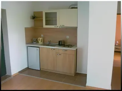 a small kitchen with a sink and a counter at Villa Denta in Nesebar
