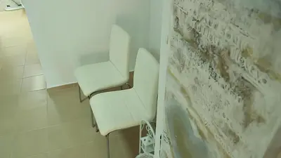 a white toilet in a bathroom next to a wall at Villa Denta in Nesebar