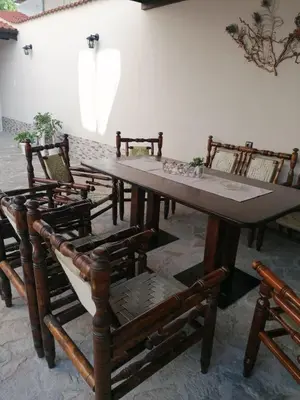 a dining room with a table and chairs at Villa Mareli in Tsarevo