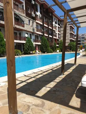 a swimming pool in front of a apartment building at MitProt luks studio Panorama Bay 2 ap.105 in Sveti Vlas