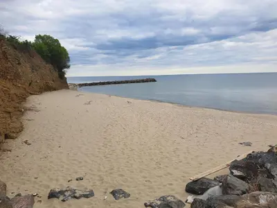 a sandy beach with rocks and the water at MitProt luks studio Panorama Bay 2 ap.105 in Sveti Vlas