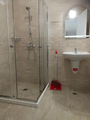 a bathroom with a shower and a sink at Donchevi Apartments in Primorsko