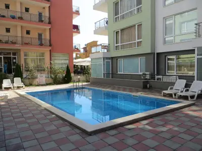 a swimming pool in the middle of a building at Apartment in Azalia 2 complex in Nesebar