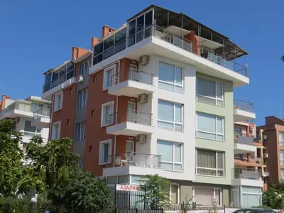 an apartment building with balconies on top of it at Apartment in Azalia 2 complex in Nesebar