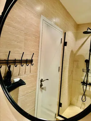 a bathroom with a shower and a mirror at Apartment Beach Kavatsi in Sozopol