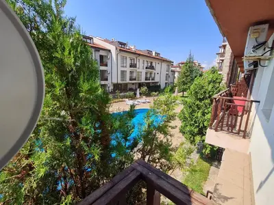 a view of a pool from a balcony of a building at MitProt Panorama Bay 2 luks apartment ap.73 in Sveti Vlas