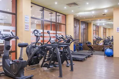 a gym with several treadmills and cardio machines at Royal Beach Apartament Hotel in Sunny Beach