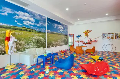 a childs room with a large mural on the wall at Royal Beach Apartament Hotel in Sunny Beach