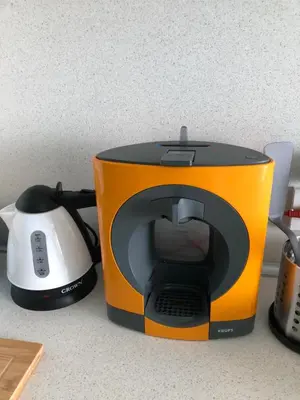 a toaster sitting on a counter next to a tea kettle at студио S in Primorsko