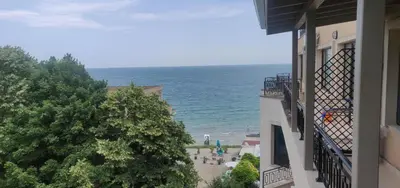 a view of the ocean from a balcony of a building at Apartment on the beach Ravda in Ravda