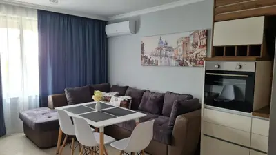 a living room with a couch and a table at Apartment on the beach Ravda in Ravda