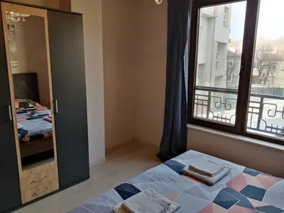 a bedroom with a bed and a window at 3 стаен апартамент идеален център Варна in Varna City