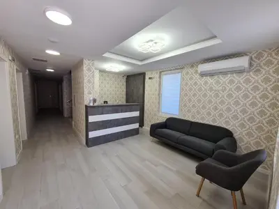 a living room with a couch and two chairs at Villa Yanevi in Ravda