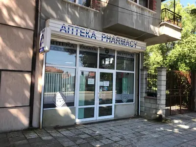 an entrance to an africa pharmacy with a sign on it at Ssenyange Guest House in Varna City