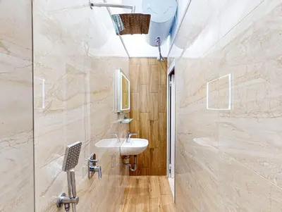 a bathroom with a sink and a mirror at Markoni 1 in Burgas City