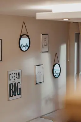 a room with three mirrors on a wall at Sunset Apartment in Pomorie