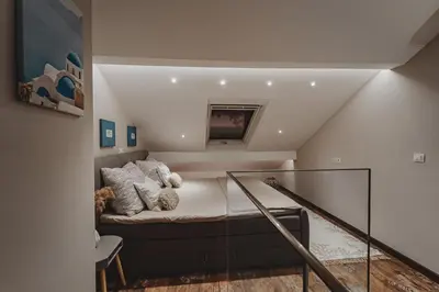 a living room with a couch in a room at Sunset Apartment in Pomorie