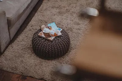 a magazine sitting on top of a rug in a living room at Sunset Apartment in Pomorie