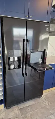 a stainless steel refrigerator with a glass counter top at Seaman's house in Burgas City