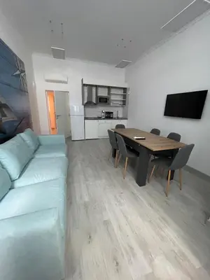 a living room with a couch and a table at Seaman's house in Burgas City