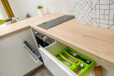 a kitchen with a counter with a green drawer at Charisma apt - lux at top city center in Varna City