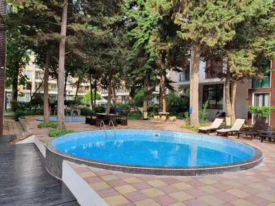 a swimming pool in the middle of a courtyard at AMARA-BOUTIQUE & DESIGN - Студио in Ravda