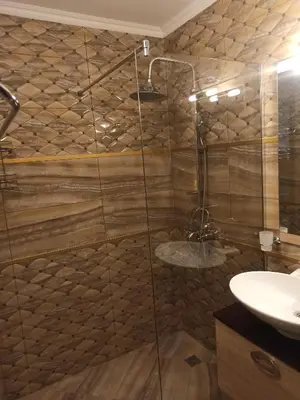 a bathroom with a shower and a sink at AMARA-BOUTIQUE & DESIGN - Студио in Ravda