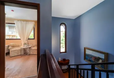a living room with blue walls at Luxury 3-bedroom villa in Sozopolis with sea view in Sozopol