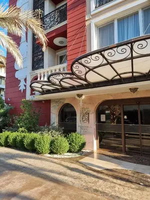 an entrance to a building with a balcony at Messembria Resort in Sunny Beach