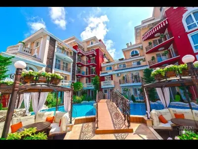 a resort with a swimming pool and some buildings at Messembria Resort in Sunny Beach