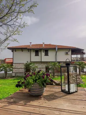 a house with a plant in front of it at La Veranda къща за гости Царево in Tsarevo