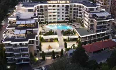 an aerial view of a building with a swimming pool at Valencia Gardens Luxury Studios in Nesebar