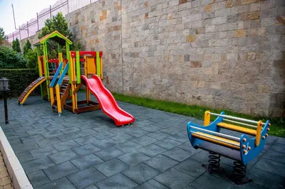 a playground with a slide and a play set at Helios Studio in a Complex in St Vlas by Flat Mаnаger in Sveti Vlas