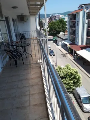 a balcony of a building with a view of a street at Къща за гости WEST in Sunny Beach